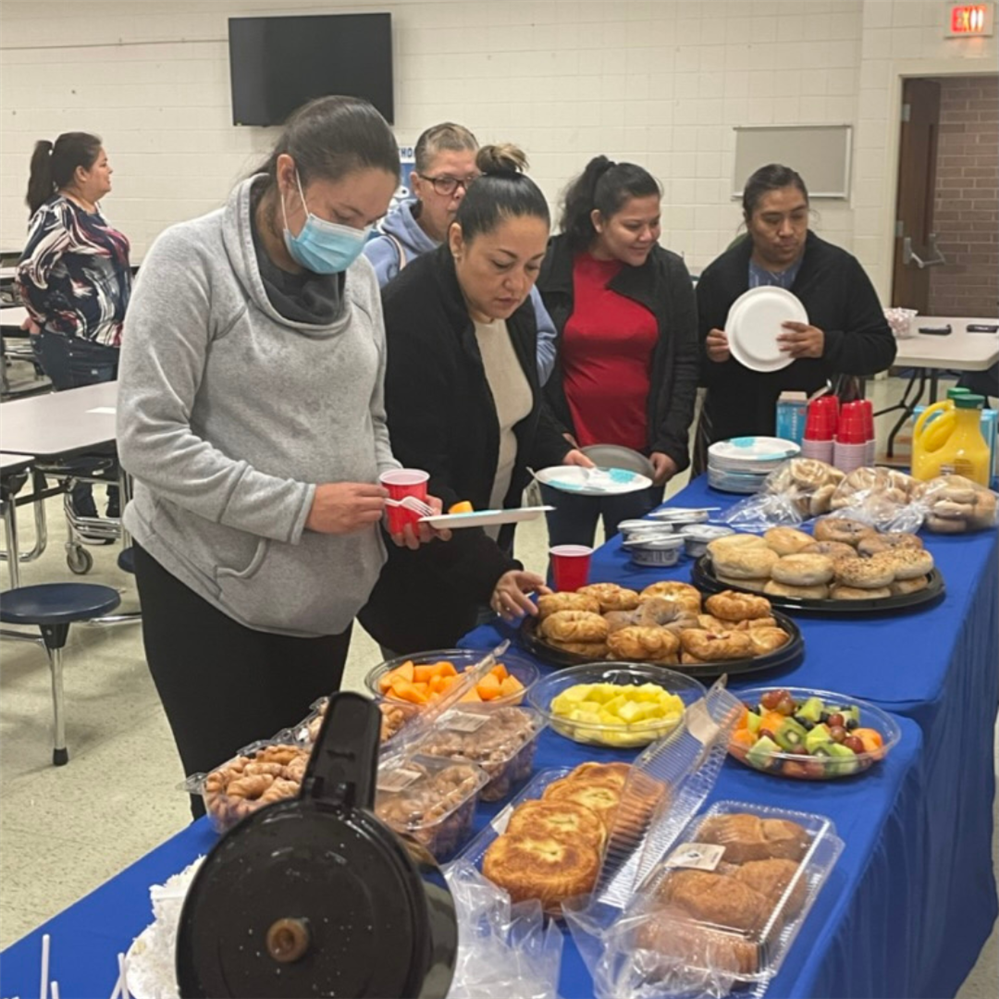  Parents enjoy breakfast at Parent Coffee Hour.